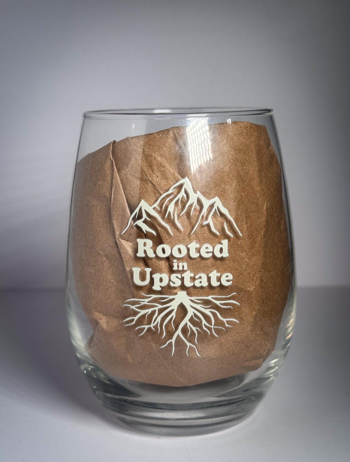Rooted in Upstate Logo Stemless Wine Glass | cream logo